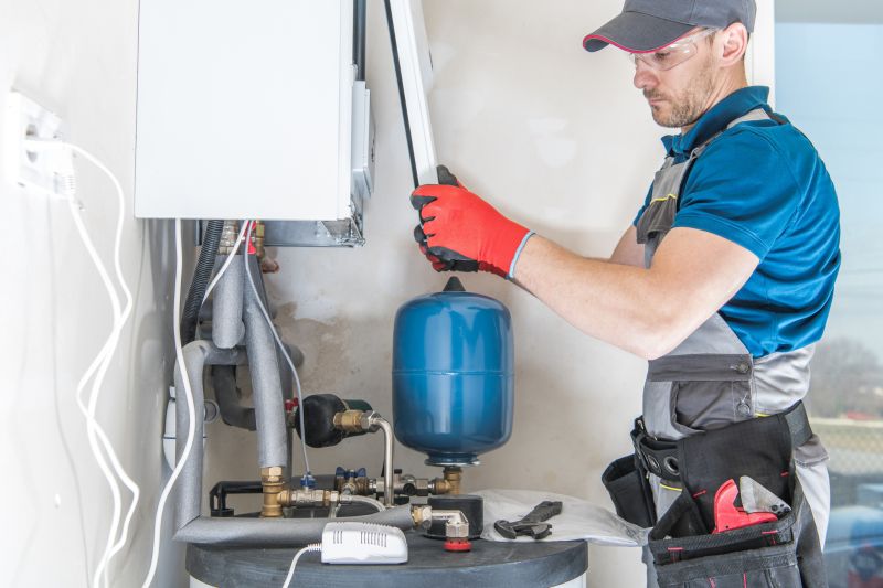 Qualified Technician Installing Water Heater